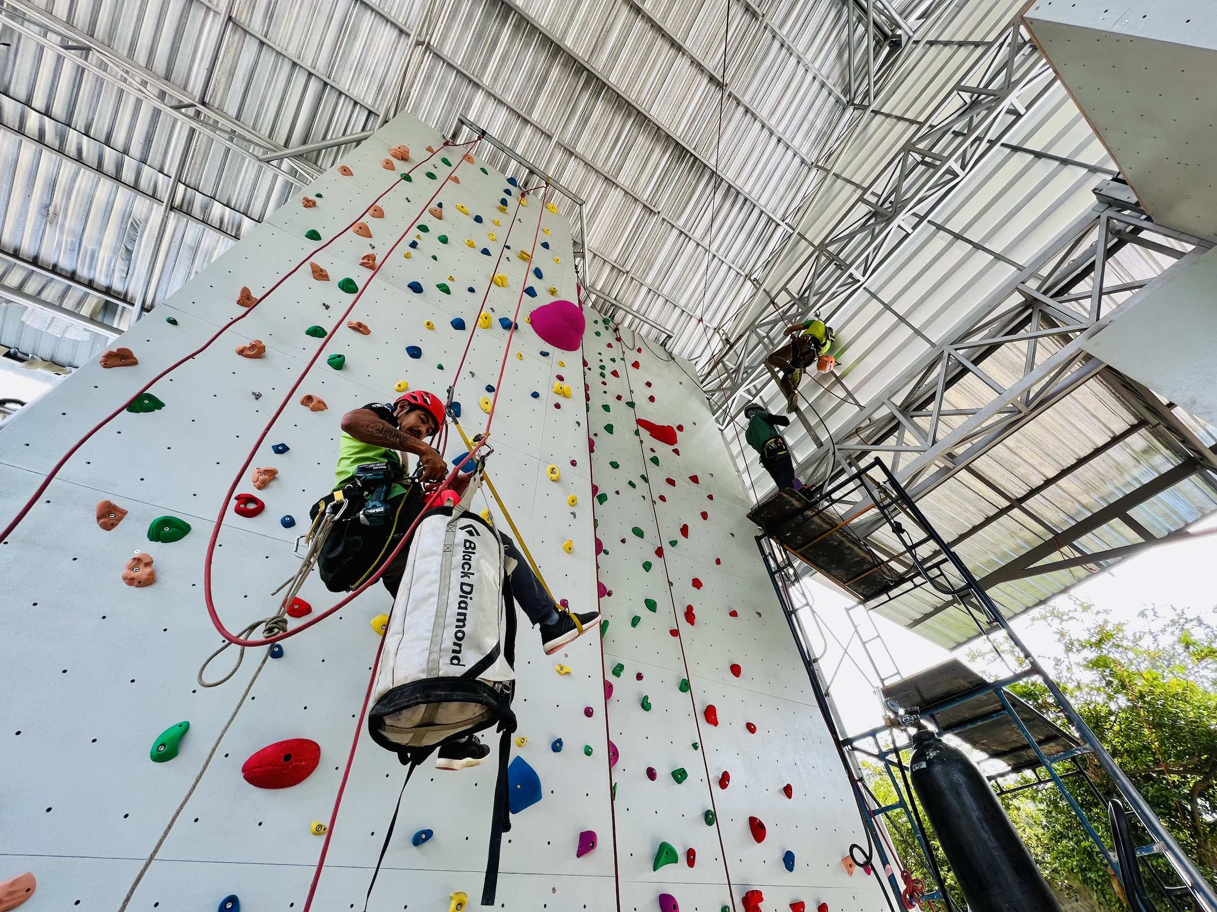Route setters working at Progression Vertical in Chiang Mai, Thailand
